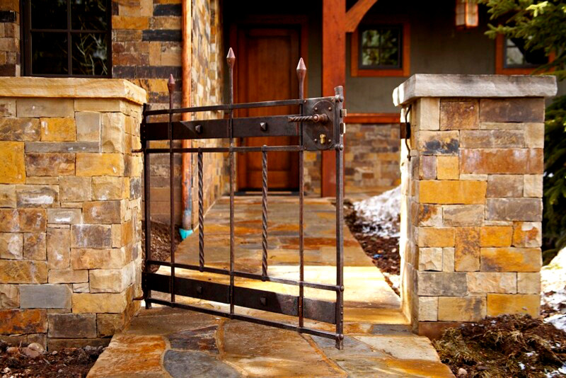 This is an example of a mid-sized rustic partial sun front yard stone garden path in Denver.
