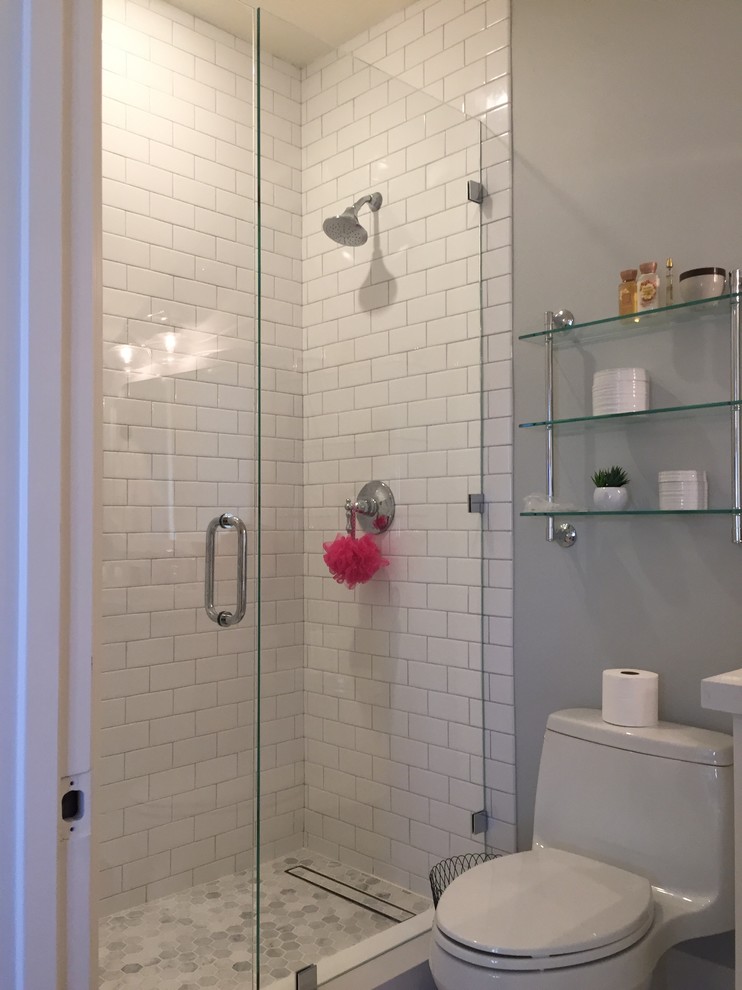 Photo of a mid-sized contemporary master bathroom in Los Angeles with furniture-like cabinets, grey cabinets, a corner shower, porcelain tile, porcelain floors and a hinged shower door.