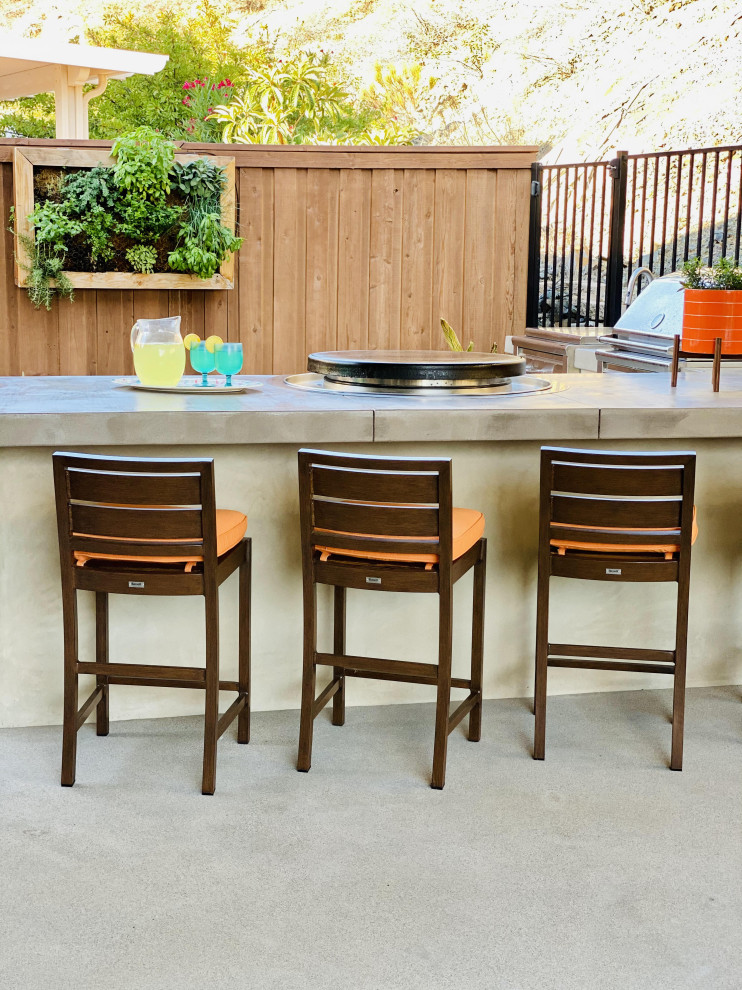 This is an example of a large modern back patio in San Diego with an outdoor kitchen, tiled flooring and a gazebo.