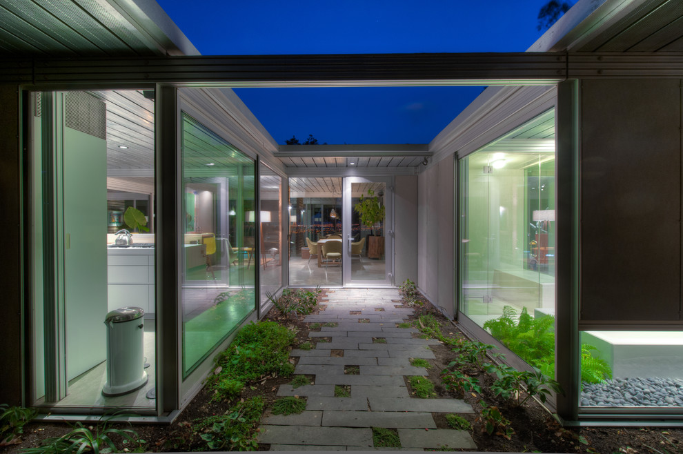 Photo of a contemporary entryway in San Francisco with a glass front door.