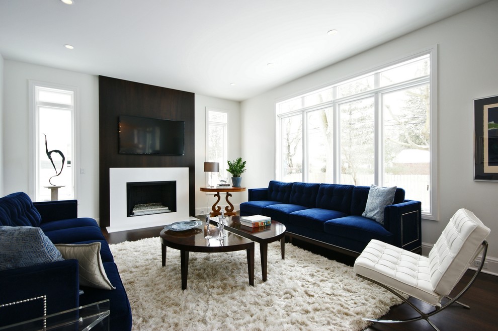Photo of a contemporary living room in Detroit with white walls.
