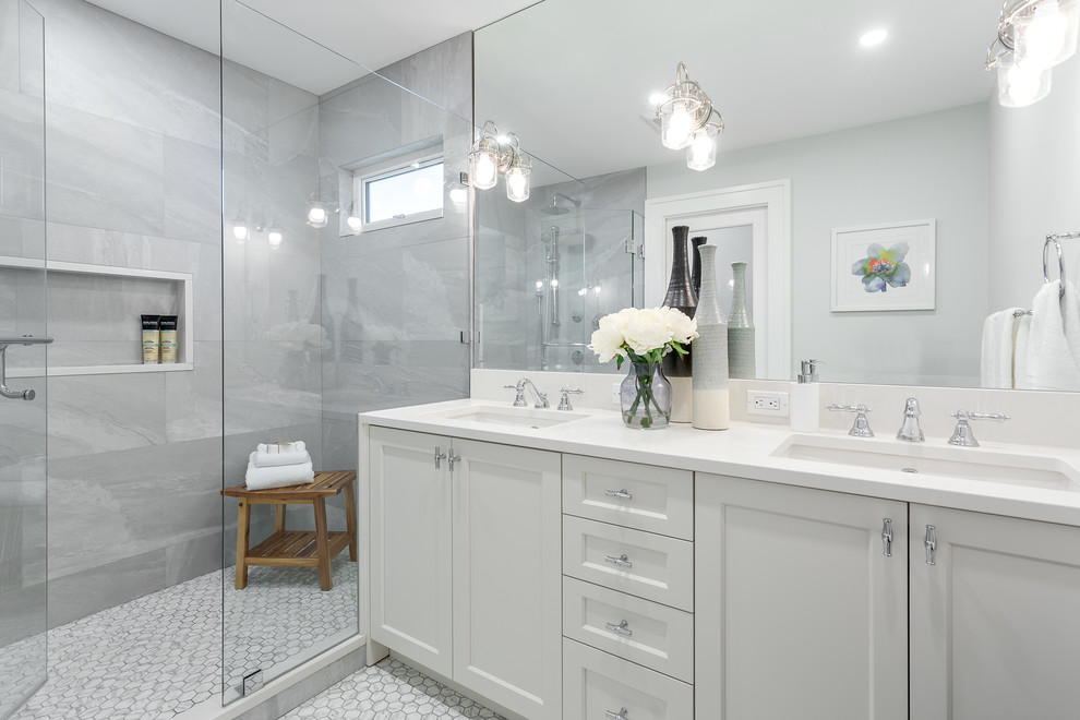 Design ideas for a small transitional master bathroom in Vancouver with gray tile, porcelain tile, grey walls, porcelain floors, an undermount sink, engineered quartz benchtops, white floor, a hinged shower door, white benchtops, recessed-panel cabinets, white cabinets and an alcove shower.