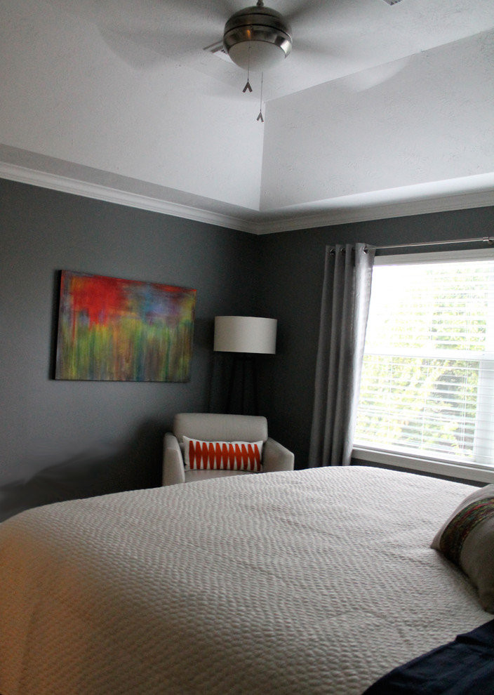 Mid-sized modern master bedroom in Houston with grey walls and carpet.