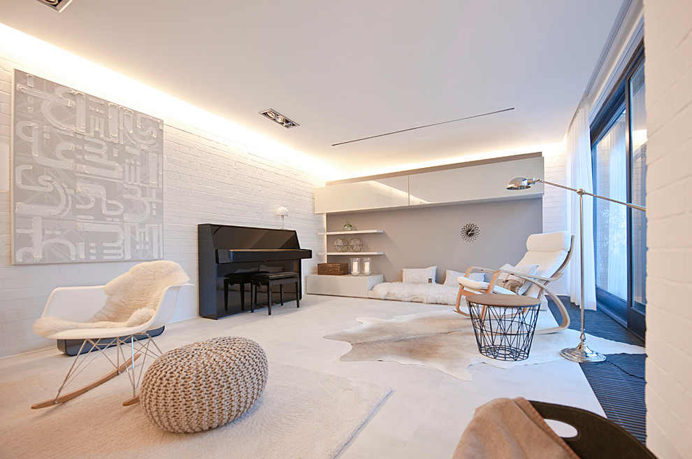 Large scandinavian open concept living room in Munich with white walls, porcelain floors, a tile fireplace surround, a concealed tv and a music area.