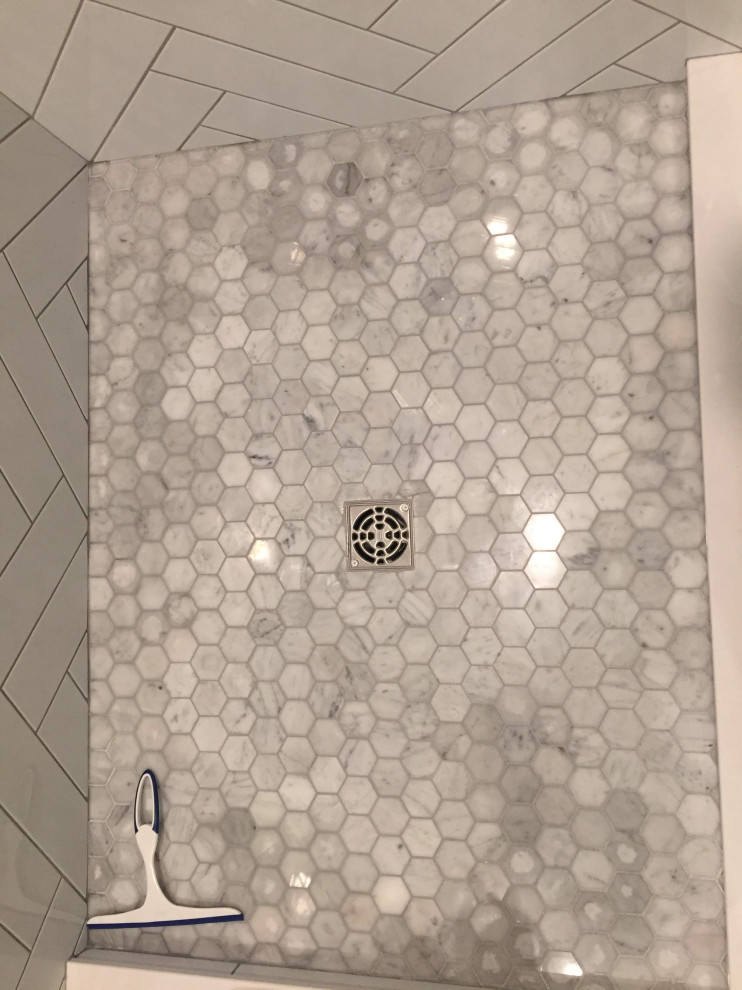 marble hex shower floor not drying consistently