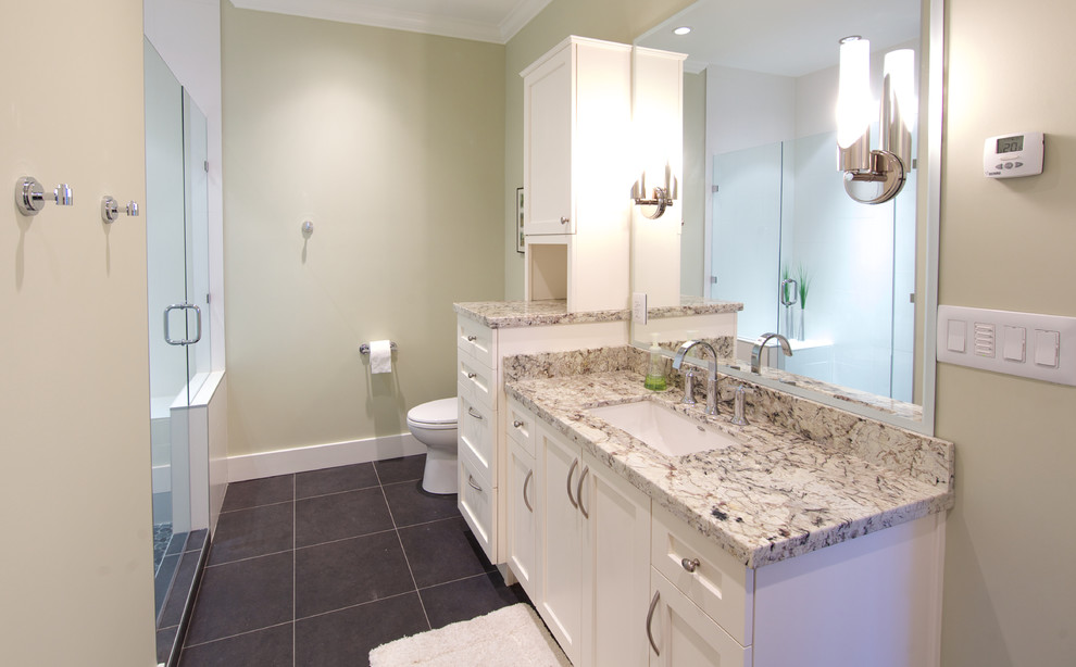 Traditional master bathroom in Vancouver with shaker cabinets, white cabinets, a two-piece toilet, gray tile, beige walls and an undermount sink.