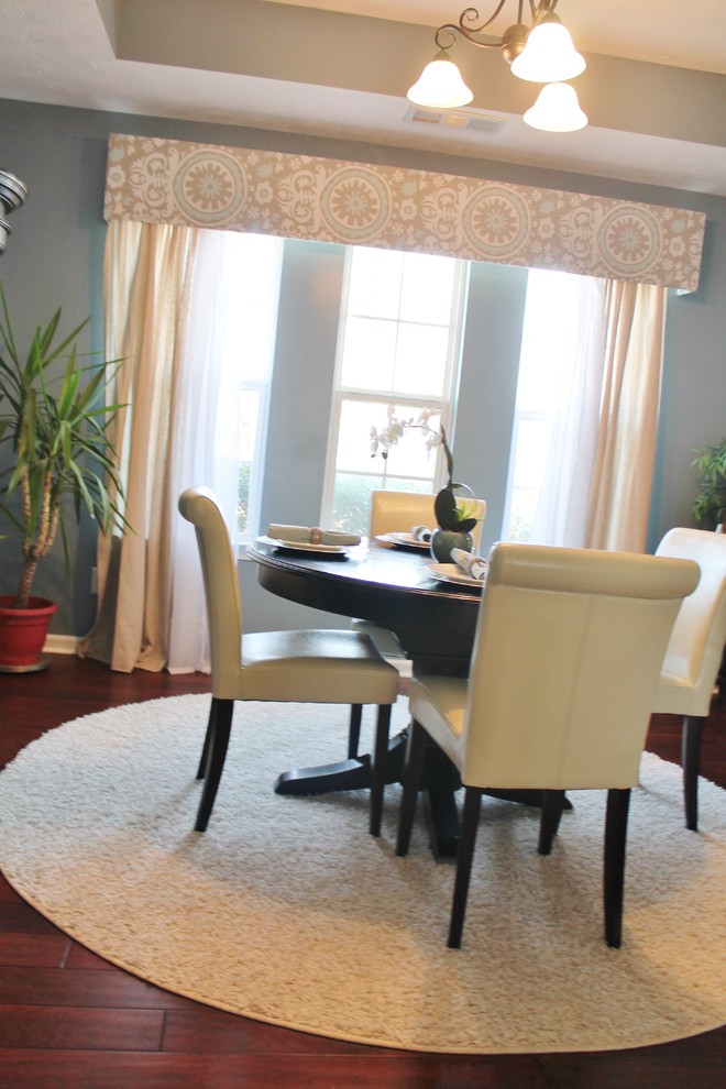 Small traditional separate dining room in Birmingham with blue walls, dark hardwood floors and no fireplace.
