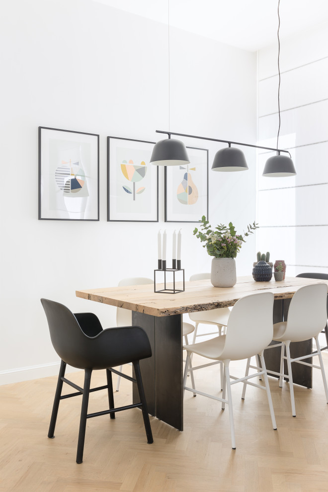 Inspiration for a large scandinavian dining room in Rome with white walls and beige floor.