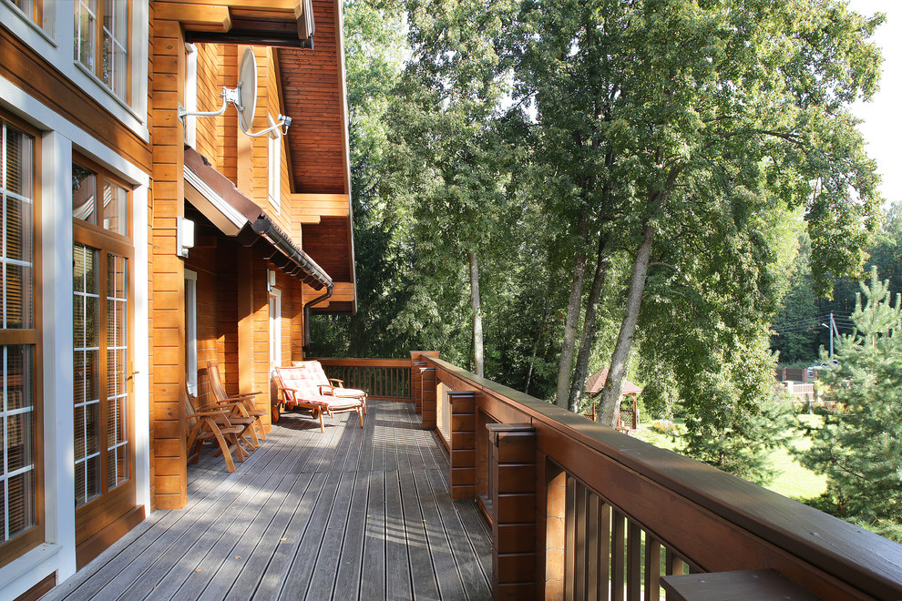 Дом из клееного бруса с цокольным этажом и американской террасой
