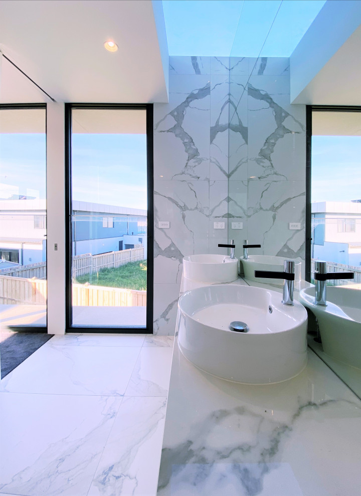 Design ideas for a mid-sized contemporary master bathroom in Melbourne with beaded inset cabinets, light wood cabinets, a corner tub, an open shower, white tile, marble, white walls, marble floors, a vessel sink, marble benchtops, white floor, a double vanity and a floating vanity.