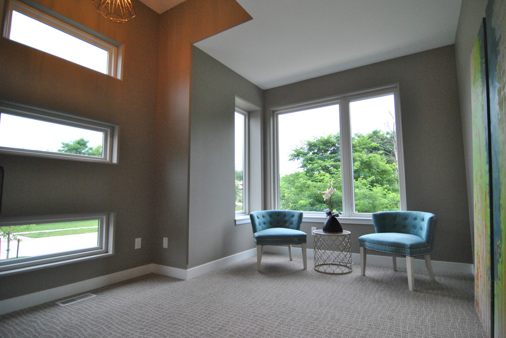 Inspiration for a mid-sized modern study room in Cedar Rapids with grey walls and carpet.
