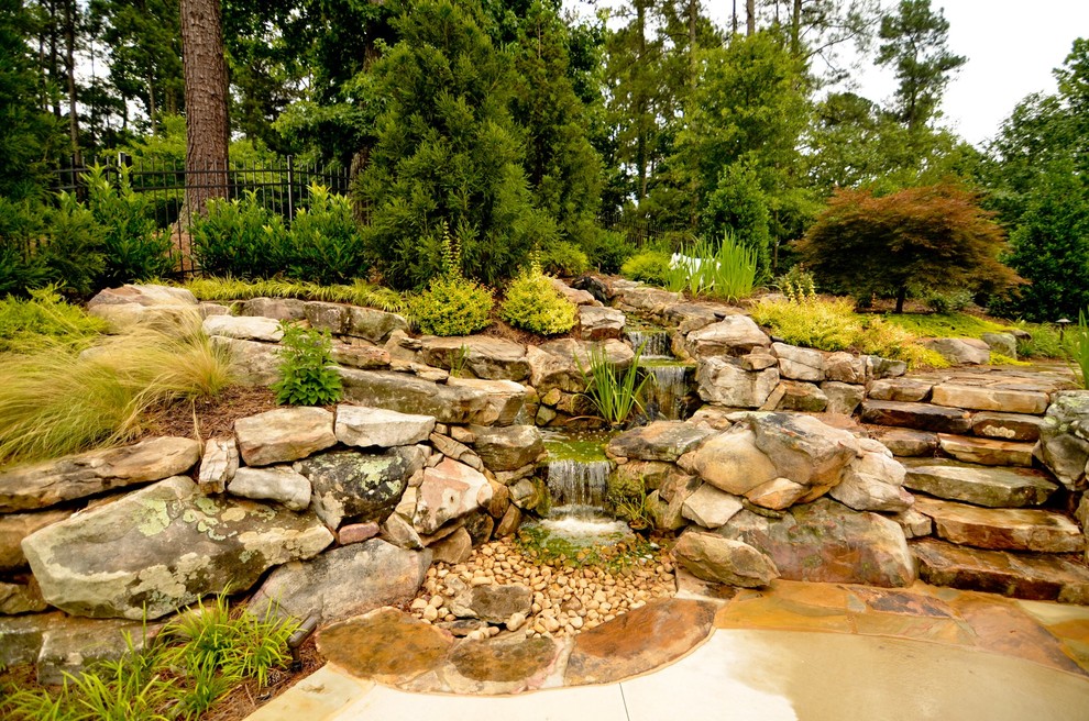 Inspiration for a traditional garden in Atlanta with a water feature.