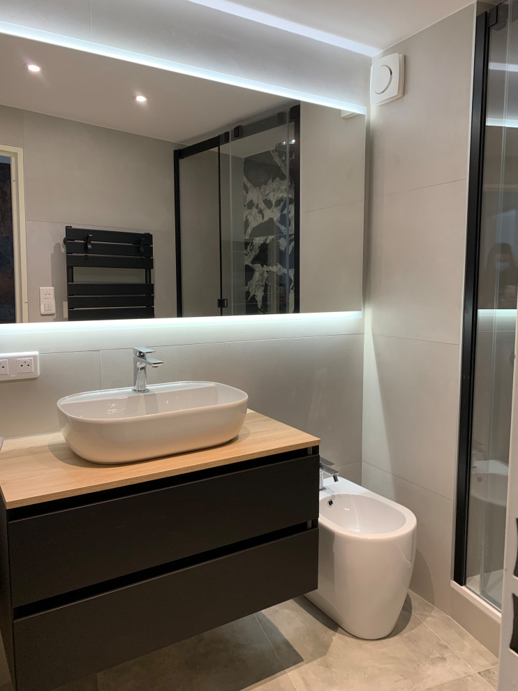 Design ideas for a small modern 3/4 bathroom in Montpellier with beige tile, beige walls, ceramic floors, a vessel sink, laminate benchtops, grey floor, beige benchtops, a single vanity, flat-panel cabinets, black cabinets, a double shower, a two-piece toilet, ceramic tile, a sliding shower screen and a floating vanity.