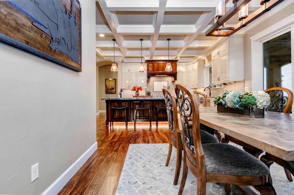 Inspiration for a large country open plan dining in Boise with grey walls, medium hardwood floors, no fireplace and brown floor.