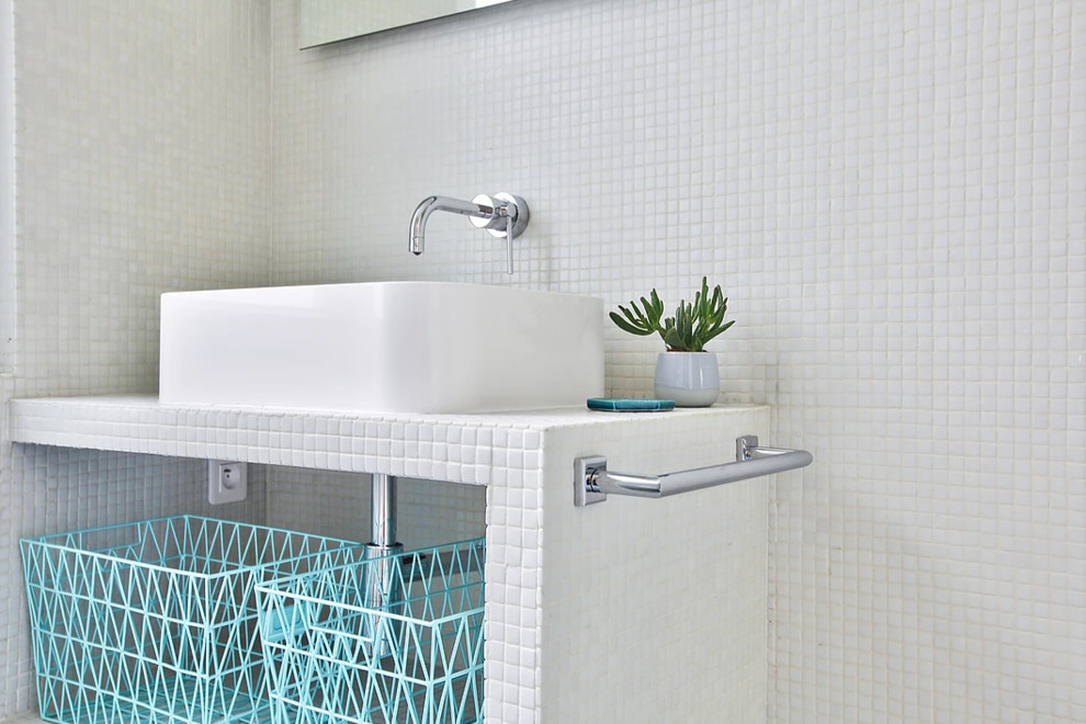 Photo of a small modern 3/4 bathroom in Paris with white cabinets, a curbless shower, a wall-mount toilet, white tile, mosaic tile, white walls, cement tiles, a drop-in sink, grey floor, an open shower, tile benchtops and white benchtops.