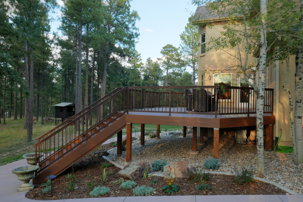 Mid-sized elegant backyard metal railing deck photo in Denver