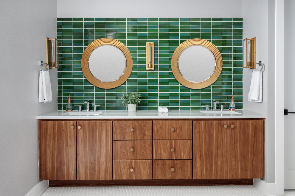 Design ideas for a mid-sized midcentury master bathroom in Austin with flat-panel cabinets, medium wood cabinets, a freestanding tub, green tile, subway tile, grey walls, ceramic floors, an undermount sink, quartzite benchtops, white floor, a hinged shower door, white benchtops, a double vanity and a built-in vanity.