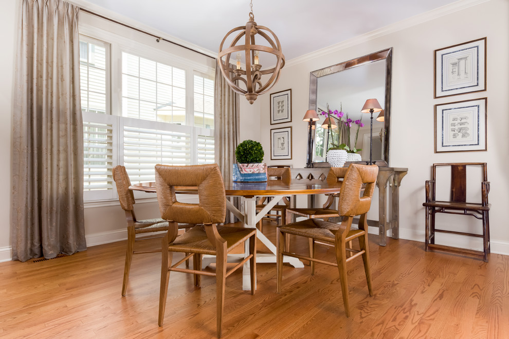 Inspiration for a mid-sized transitional light wood floor great room remodel in Chicago with beige walls and no fireplace