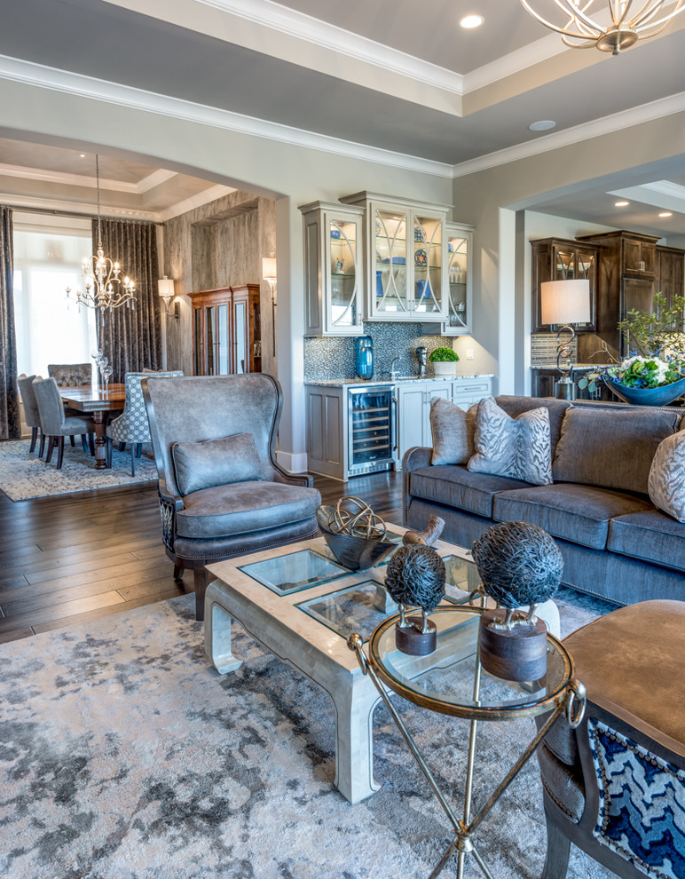 Inspiration for a transitional open concept living room in Kansas City with grey walls, dark hardwood floors, a standard fireplace, a tile fireplace surround and a wall-mounted tv.