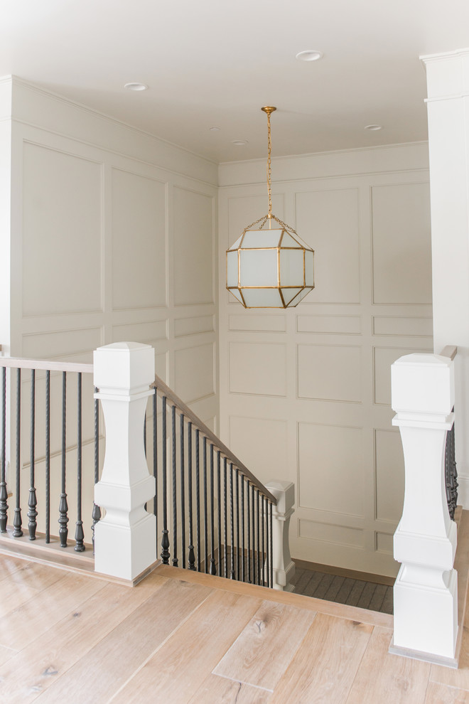 Staircase - mid-sized traditional wooden u-shaped mixed material railing staircase idea in Salt Lake City