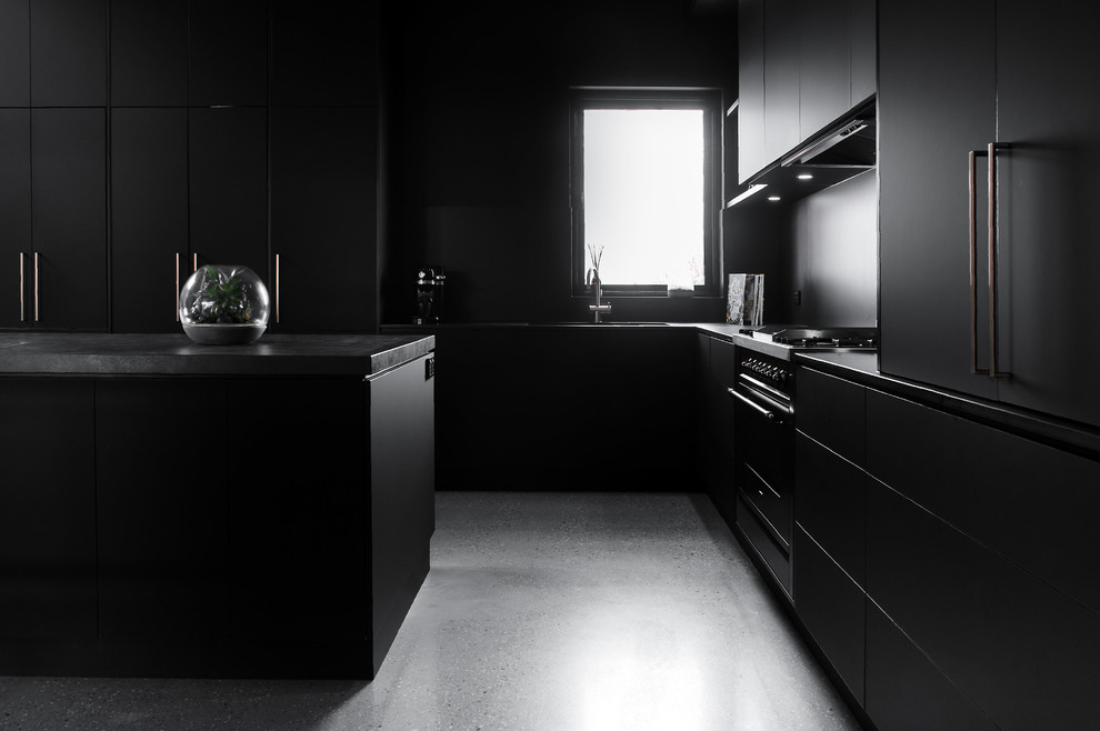 Photo of a large industrial galley separate kitchen in Hobart with flat-panel cabinets, black cabinets, concrete benchtops, with island and grey benchtop.