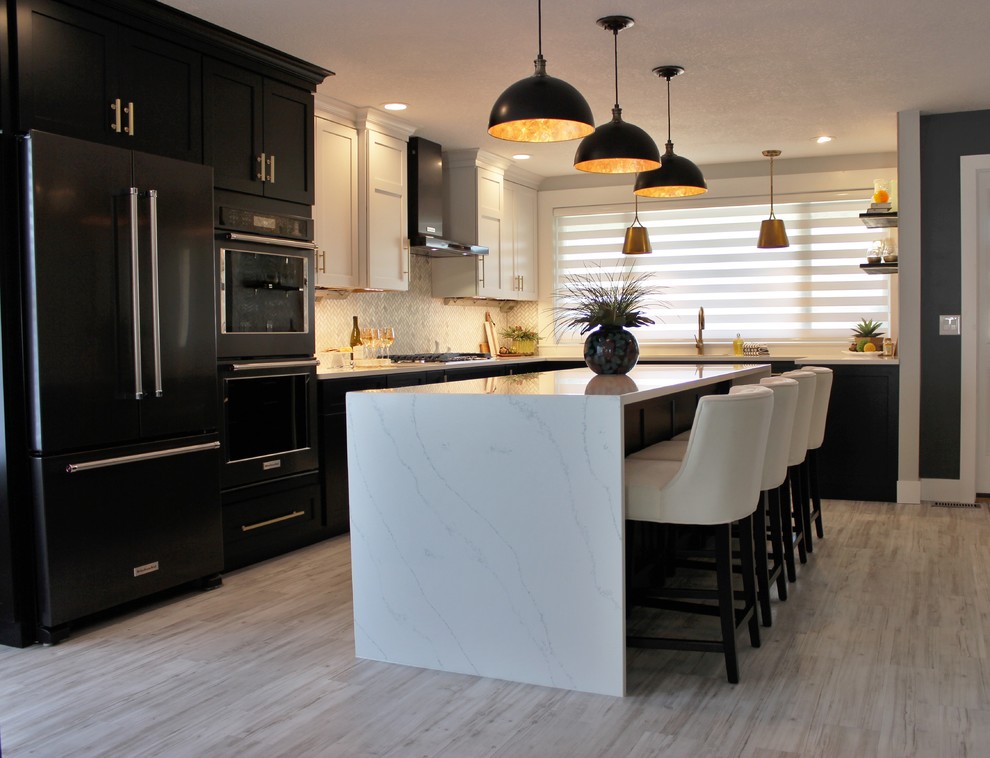 Photo of a large transitional l-shaped open plan kitchen in Other with an undermount sink, flat-panel cabinets, black cabinets, quartz benchtops, white splashback, marble splashback, black appliances, vinyl floors, with island and grey floor.