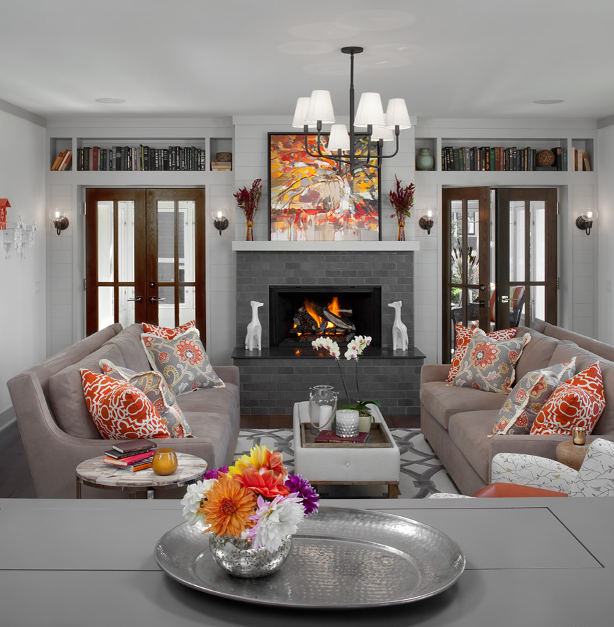 Design ideas for a transitional formal open concept living room in Grand Rapids with white walls, dark hardwood floors, a wood stove, a brick fireplace surround, brown floor and planked wall panelling.