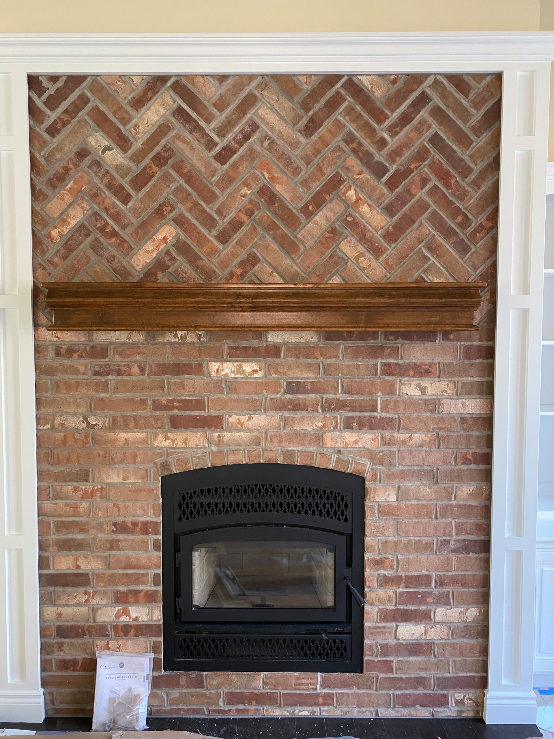 Wood burning fireplace with custom brickwork front detail