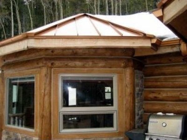 Mid-sized mountain style red two-story wood exterior home photo