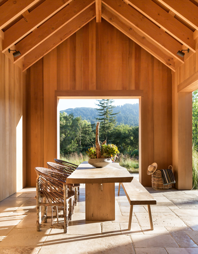 Photo of an expansive country patio in San Francisco with a roof extension.