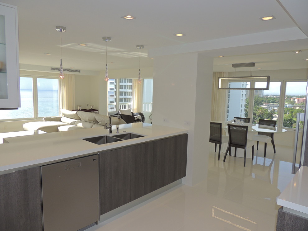 Design ideas for a mid-sized contemporary l-shaped eat-in kitchen in Miami with a double-bowl sink, flat-panel cabinets, brown cabinets, quartzite benchtops, stainless steel appliances, porcelain floors and with island.