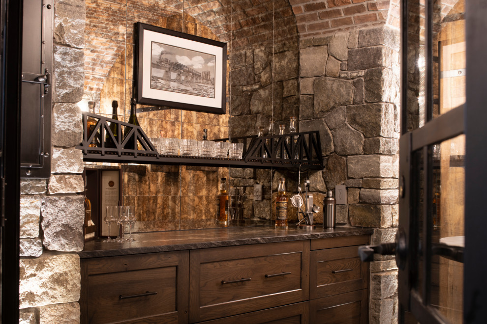 Design ideas for a rustic home bar in Minneapolis with stone tiled splashback.