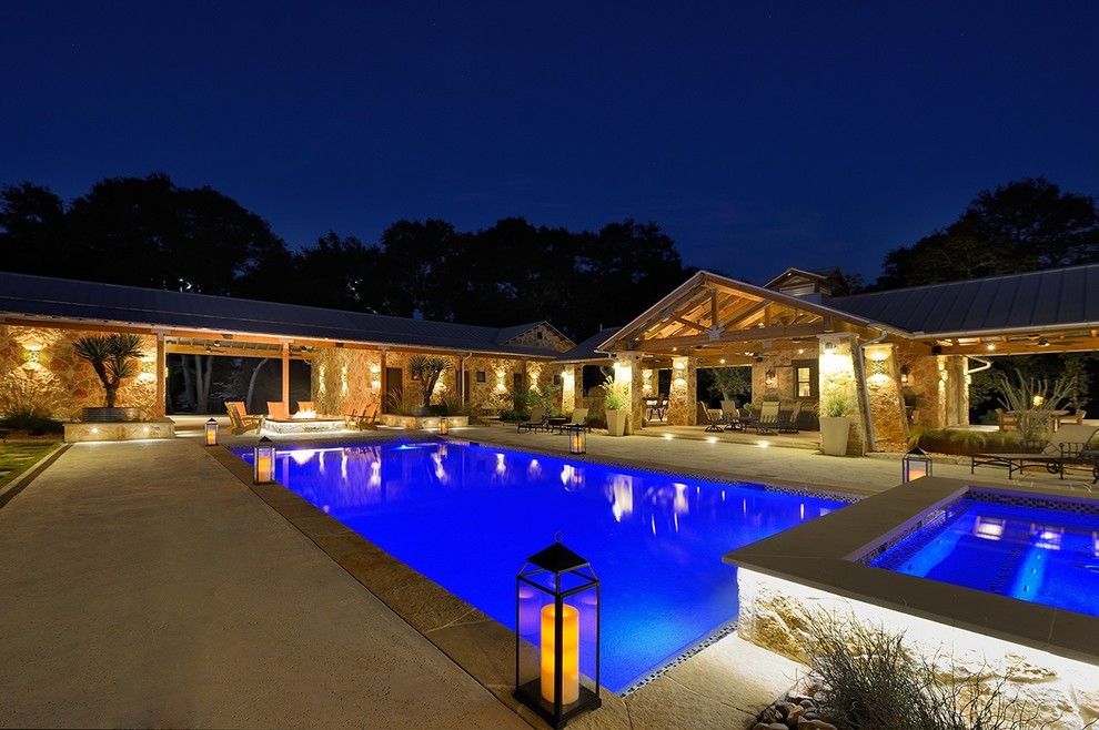 Inspiration for a large backyard rectangular pool in Houston with a hot tub and concrete slab.
