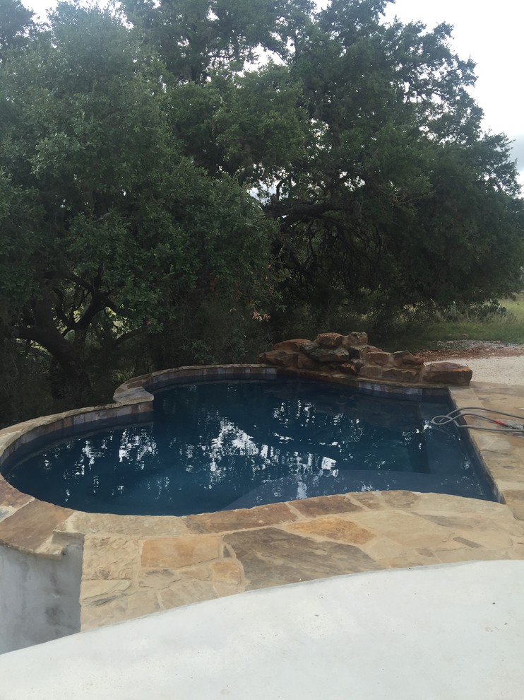 Inspiration for a rustic pool remodel in Austin