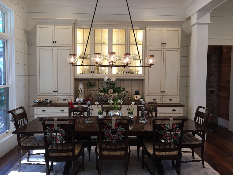 This is an example of a mid-sized country kitchen/dining combo in Atlanta with white walls and medium hardwood floors.