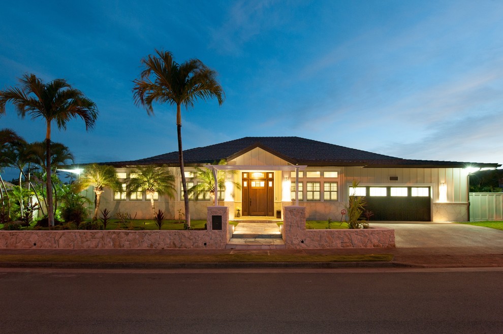 Example of a large transitional beige one-story exterior home design in Hawaii