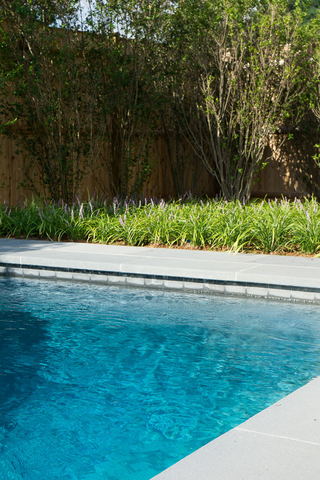 Photo of a mid-sized country backyard rectangular pool in Boston with a pool house and decking.