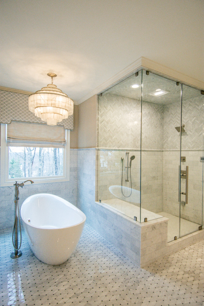 Photo of a transitional master bathroom in Atlanta with a freestanding tub, a corner shower, gray tile, white tile, white floor and a hinged shower door.
