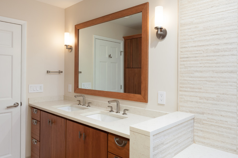 Inspiration for a large asian master bathroom in Newark with an undermount sink, flat-panel cabinets, medium wood cabinets, marble benchtops, an open shower, a wall-mount toilet, beige tile, ceramic tile, beige walls and ceramic floors.
