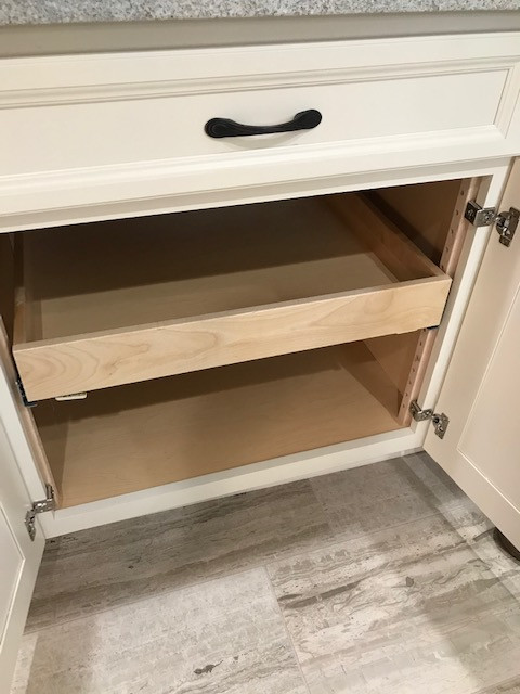 Example of a mid-sized transitional galley porcelain tile and beige floor eat-in kitchen design with an undermount sink, flat-panel cabinets, beige cabinets, granite countertops, multicolored backsplash, mosaic tile backsplash, stainless steel appliances, a peninsula and white countertops