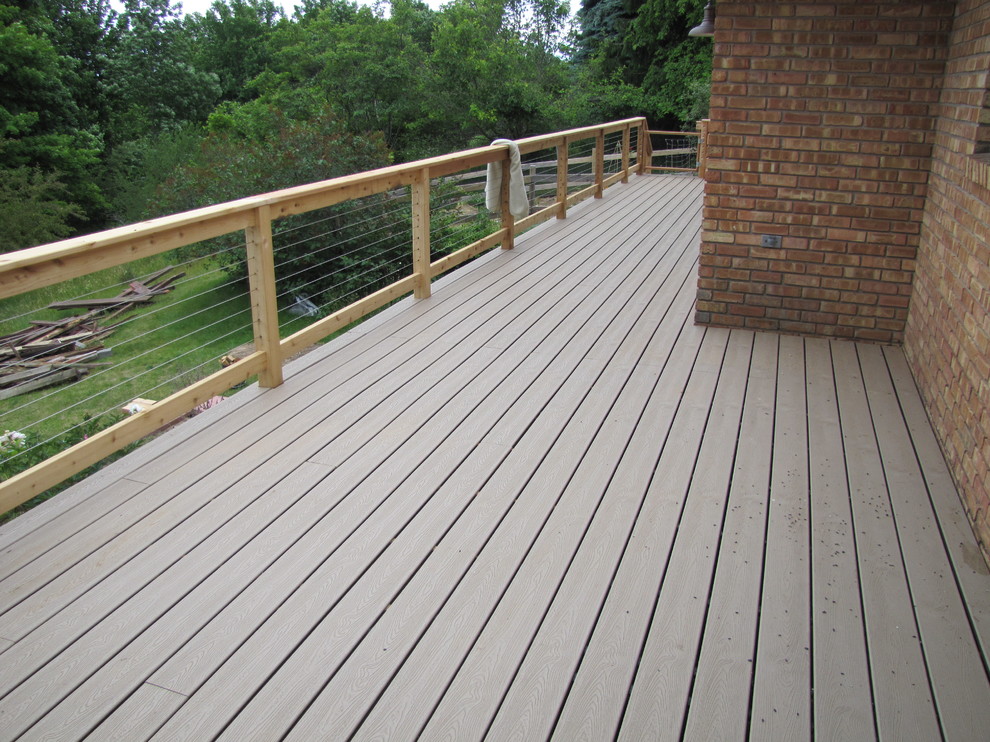 Inspiration for a large rustic backyard deck remodel with no cover