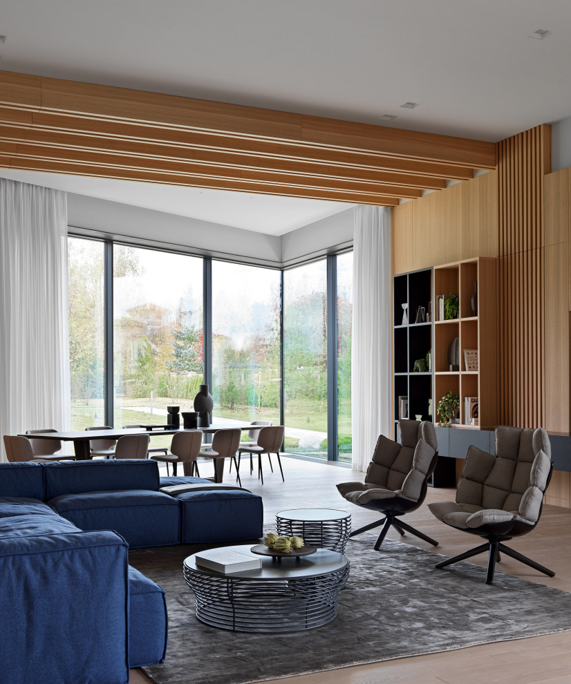 Идея дизайна: огромная гостиная комната в стиле модернизм