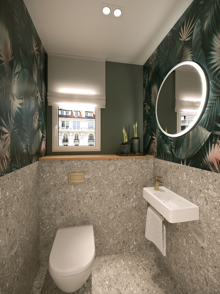 На фото: маленький туалет в современном стиле с инсталляцией, серой плиткой, керамической плиткой, зелеными стенами, полом из терраццо, подвесной раковиной, серым полом, белой столешницей и обоями на стенах для на участке и в саду