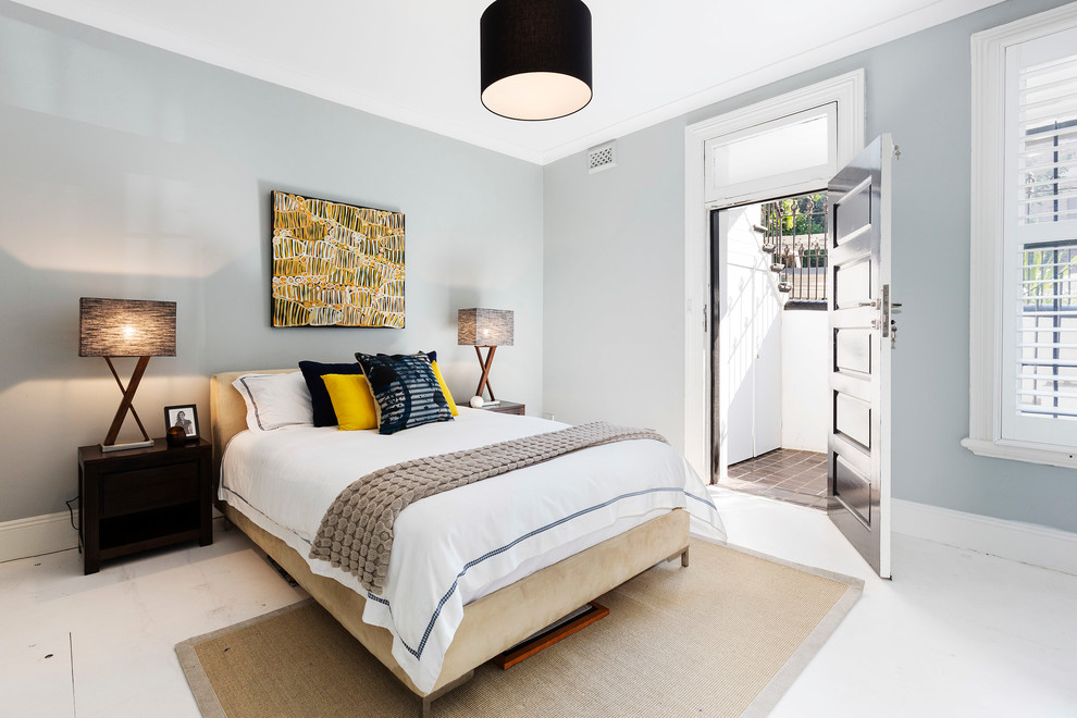 Mid-sized transitional bedroom in Sydney with blue walls.