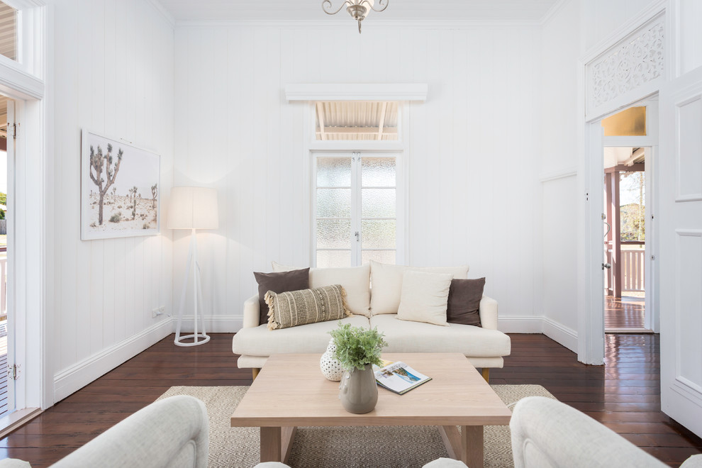 Scandinavian formal enclosed living room in Brisbane with white walls, dark hardwood floors and brown floor.