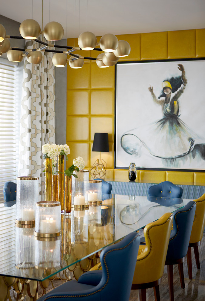 Inspiration for a transitional dining room remodel with yellow walls