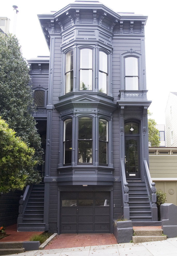 Design ideas for a mid-sized traditional two-storey purple exterior in San Francisco with wood siding.