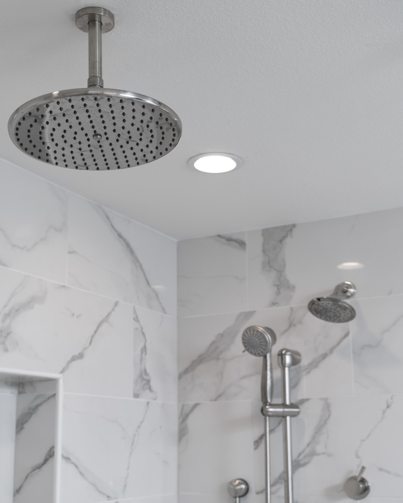 Inspiration for a large transitional master multicolored tile and mosaic tile porcelain tile home design remodel with gray walls, an undermount sink and quartz countertops