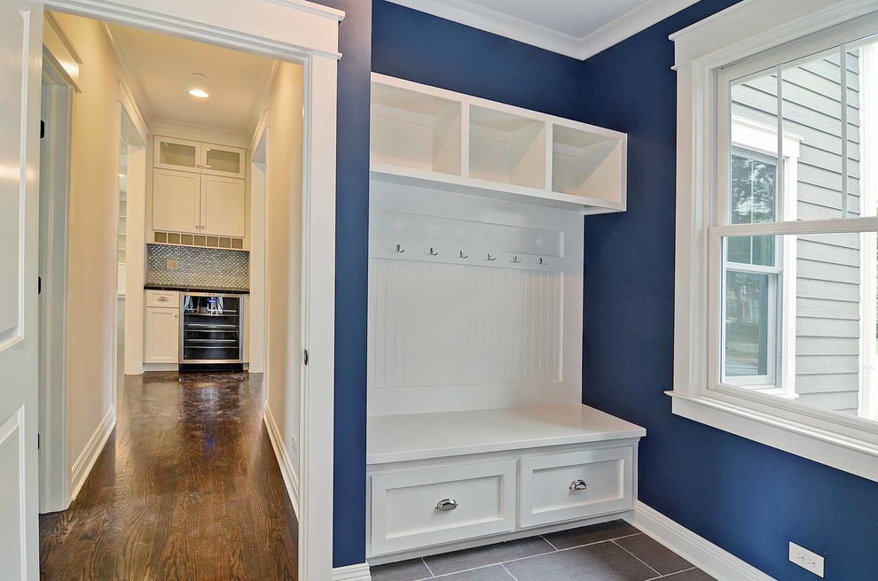 Small transitional mudroom photo in Chicago with blue walls