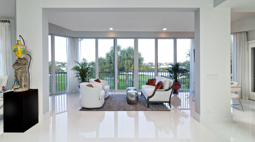 Design ideas for a contemporary family room in Miami with white walls and white floor.